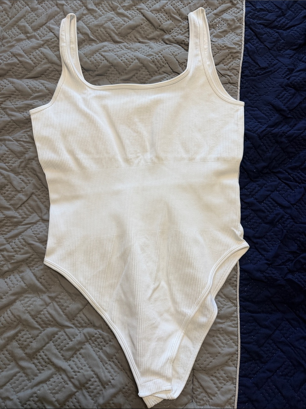 OQQ Woman’s White Ribbed One-Piece Bodysuit